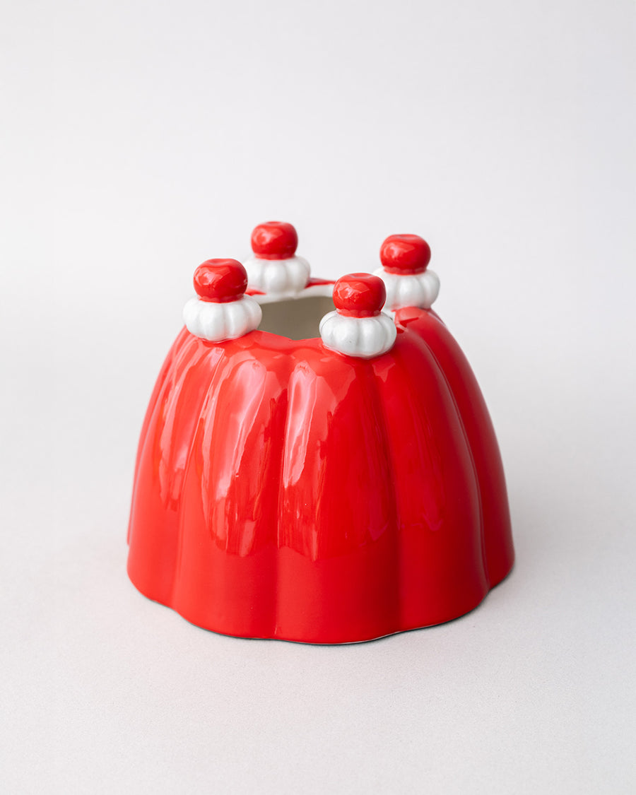 side view of red jello mold vase/planter