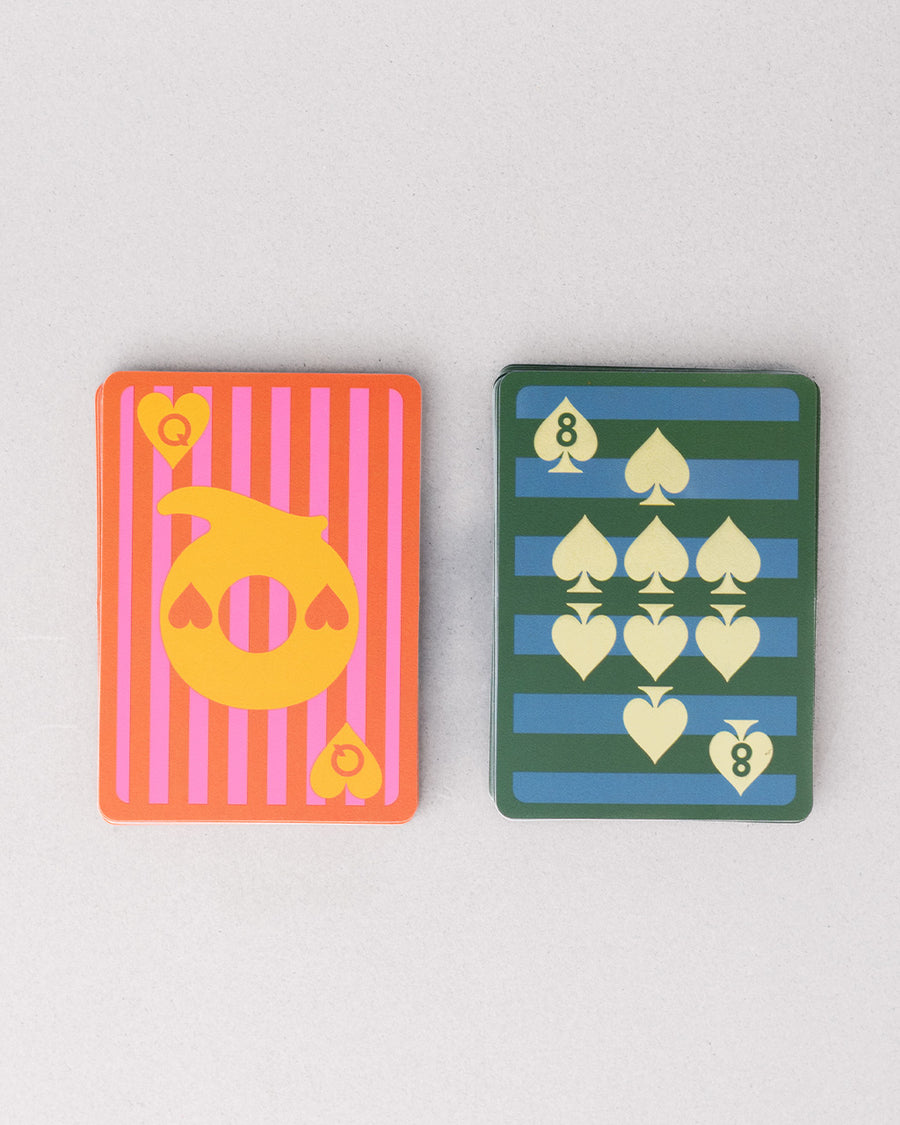 stack of colorful checkered card case with green tree air fresher graphic that says 'on the road again! PLEASANTVILLE USA' with various colorful stripe print on the face side