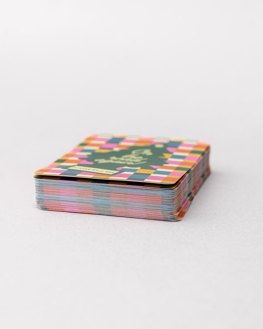 colorful checkered card case with green tree air fresher graphic that says 'on the road again! PLEASANTVILLE USA' stacked