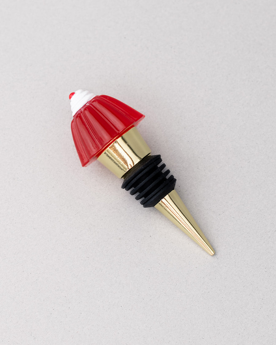 gold brass wine stopper with red jello mold topper and black rubber stopper