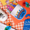set of 4 colorful sardine bookmarks with 'sardines in olive oil can' holder on a gingham tablecloth surrounded by fun bookmarks