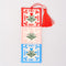 red, pink and blue embroidered folk floral bookmark with red tassel top