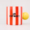 reverse side of red and white vertical stripe mug with yellow ball handle and double sided typography with 'BONJOUR!' on one side and 'AU REVOIR' on the other