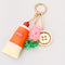 side view of button Fidget spinner, paint tube de-stress paint tube and beaded tulip keychain