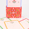 front view of red folk floral tab notes holder with dainty scalloped floral paper