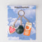 packaged fidget keychain with gold heart photo frame, enamel orange juice charm, and 8-ball de-stress ball