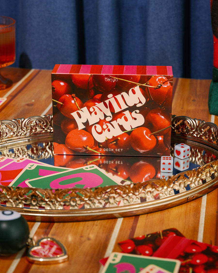 Interior of packaged set of 2 cherry print playing card decks