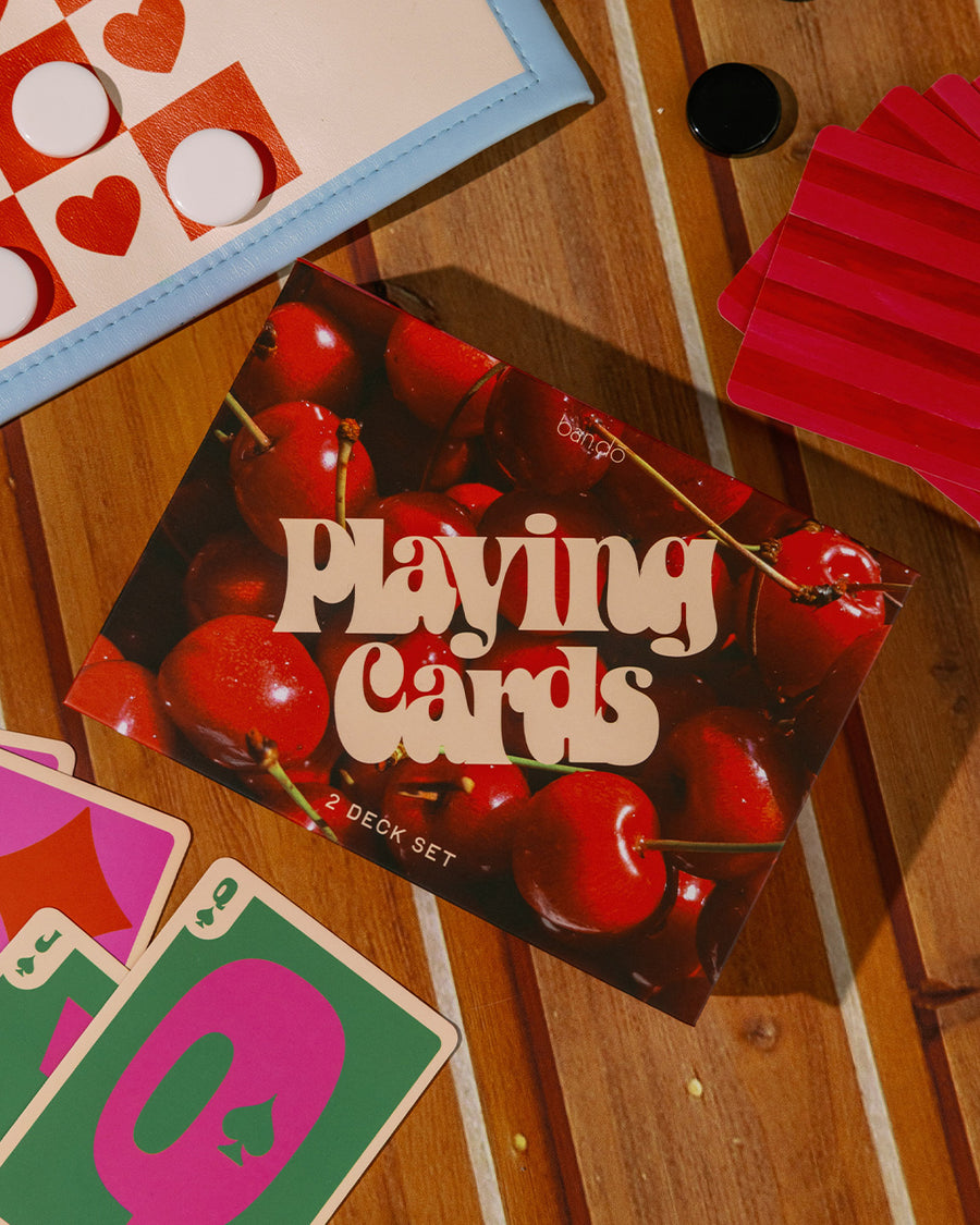 Interior of packaged set of 2 cherry print playing card decks