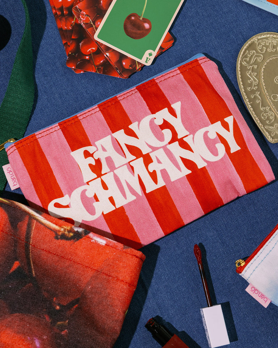 three carryall pouches: pink and red striped 'FANCY SCHMANCY', realistic cloud print, and realistic cherry print
