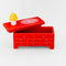 top off of red dress trinket box with yellow lamp and cat doily