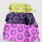 set of three 3D zip set pouches: pink with blue smiley, deep purple with light blue smiley, and yellow with hot pink smiley with items inside