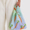 model holding rainbow gradient baby baggu with all over carrot print