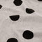 up close of black and white polka dot reversible towel