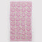 light pink towel with bright pink smileys