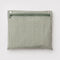 interior pouch of sage and white vertical stripe cloud carry on bag