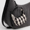 black and white gingham crescent bag charm on a purse