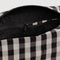 up close of black and white gingham dopp kit