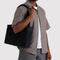 model carrying black everyday cloud bag