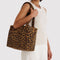 model carrying leopard print everyday cloud bag