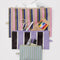 set of three colorful stripe flat pouch set with items inside