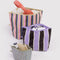set of three colorful stripe go pouch set with items inside