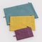 flattened set of 3 jewel colored go pouch set: wild plum, yellow, and teal