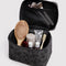 grey large cosmetic case with black ditsy floral with items inside