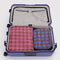 set of 2 large packing set with blue plaid and pink plaid in a suitcase
