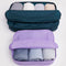 set of two large packing cubes. large navy and medium lavender filled with clothing
