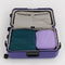 set of two large packing cubes. large navy and medium lavender in a suitcase