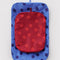 flattened set of 2 large packing cubes with red and bright red dots and blue with navy polka dots