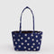medium reversible tote with navy and white polka dot and brown interior