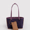 reversed side of reversible wild plum tote with dark purple interior