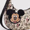 mickey head bag charm on a cream floral bag