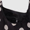 interior of black with cream polka dot with mini nylon shoulder bag