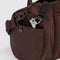 side view of brown duffle bag