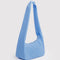 side view of light blue meringue bag with thick twist strap