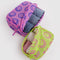 set of 2 packing cubes: small yellow with hot pink smiley print and medium pink with cobalt smiley print