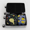 set of 2 packing cubes: small periwinkle with golden pears and medium black winter gourd in a suitcase