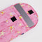 pink 13 in. laptop sleeve with gold melting star print with laptop inside