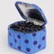 silver interior of blue polka dot lunch bag with blueberries inside