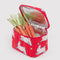 red puffy lunch bag with bunny print with carrots inside
