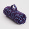 rolled plum puffy blanket with light blue smiley print