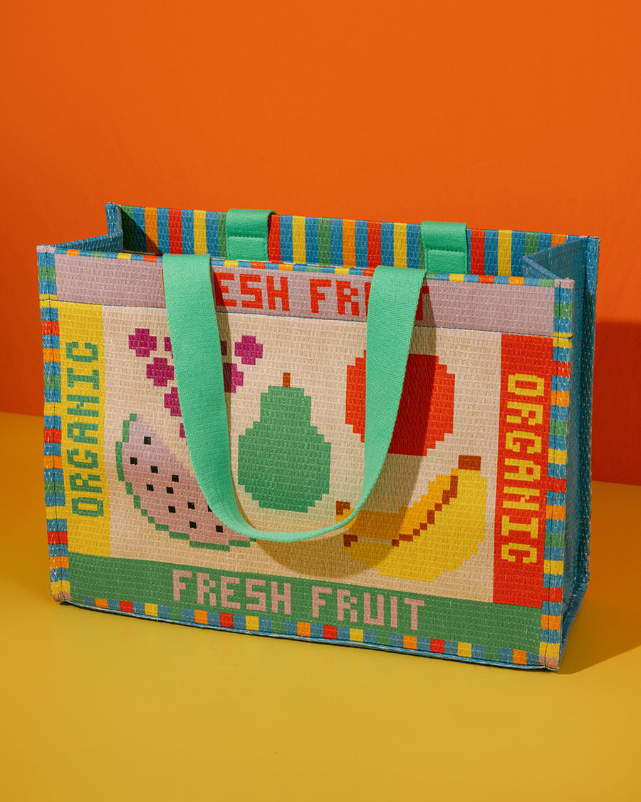 Rattan market tote with colorful fruit tile accents