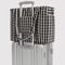 cream and black gingham small cloud carry-on bag on a suitcase