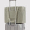 green and white vertical stripe small cloud carry on bag on a suitcase