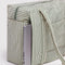 green and white vertical stripe small cloud carry on bag  with a laptop coming out of the back sleeve
