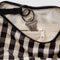 interior key leash of black and cream gingham small crescent bag