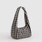 side view of black and white gingham small meringue bag