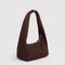 side view of brown small meringue bag with thick twist strap